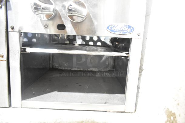 Cook Rite stainless steel gas-powered single burner stock pot range, showing controls and storage area, in used condition.