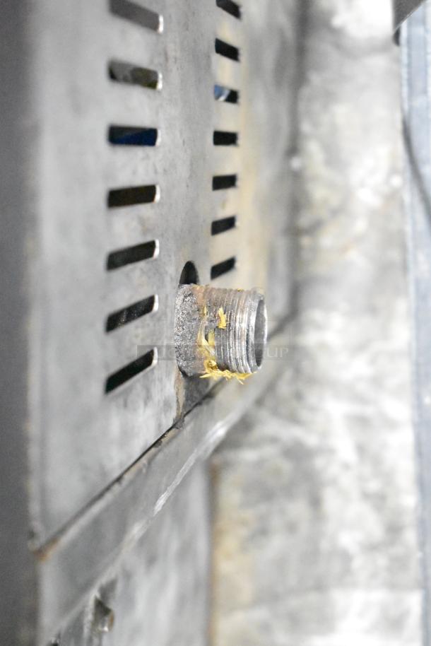 Stainless steel gas-powered stock pot range, single burner, showing connector detail. Suitable for commercial kitchens.