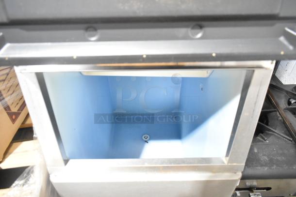 Hoshizaki KM-50MWH stainless steel commercial ice head on ice bin, 115-120 volts, 1 phase, interior view, clean condition.