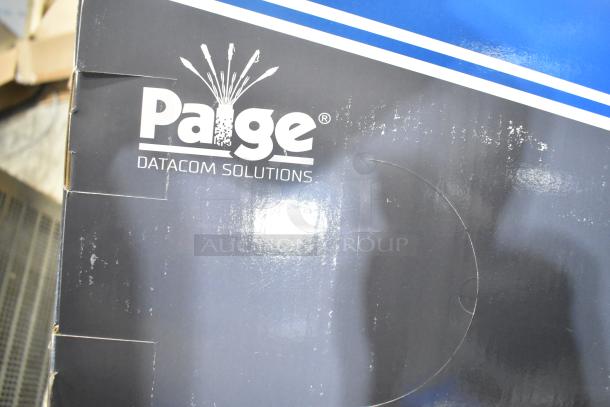 Pallet lot labeled "Paige Datacom Solutions," featuring partially visible wire spools. Packaging shows signs of wear.