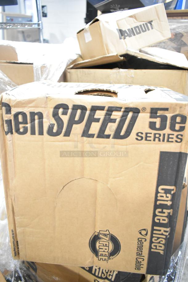 18 new boxes: Panduit Netkey NK5EPC3Y patch cord, NK4FWHY faceplate. Visible GenSPEED 5e series Cat 5e Riser marking.
