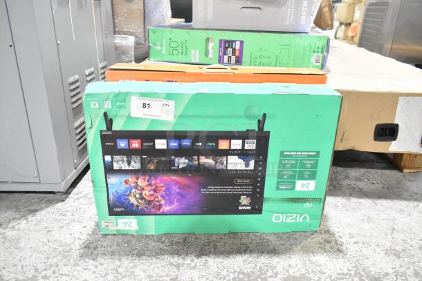 Original boxes of Onn Roku Smart TV and Vizio VHD24M-0810 on display; auction label indicates lot of two TVs.