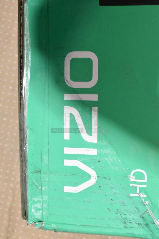 Two televisions in original boxes: Onn Roku Smart TV and Vizio VHD24M-0810. Boxes show brand labeling. Local pickup required.