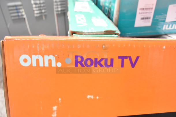 Onn Roku Smart TV box with branding. Visible box label for Vizio VHD24M-0810 behind. Boxes appear new.