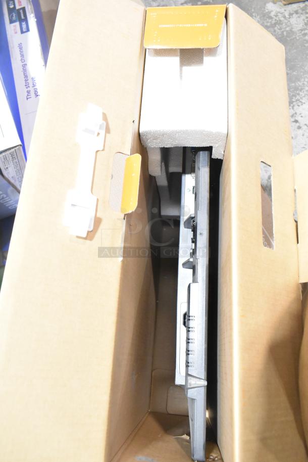 Two TVs in original boxes, including Onn Roku Smart TV and Vizio VHD24M-0810. Packaging intact, buyer must pick up.