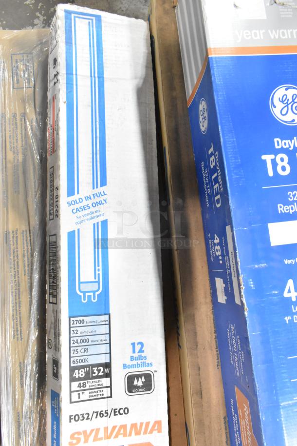 Boxes of Philips fluorescent, GE T8 LED daylight, and Sylvania tube lights. Each box holds 12 bulbs, new condition.