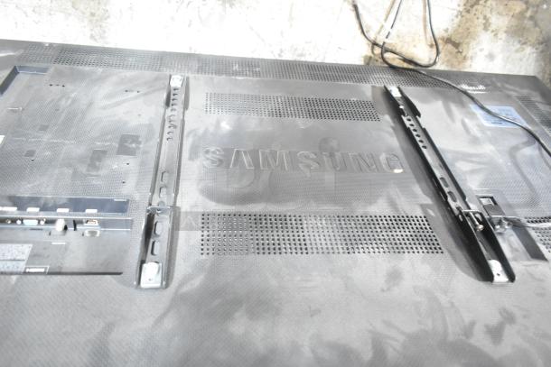 Samsung LH55DCE Television, back view showing mount brackets and ventilation. In functional condition, buyer pickup required.