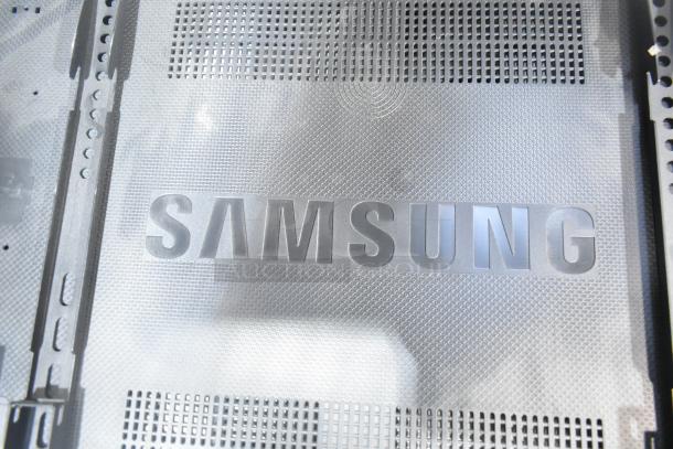 Samsung LH55DCE TV back panel with logo, metal mesh design. Requires pickup, 100-240V, 1 phase.