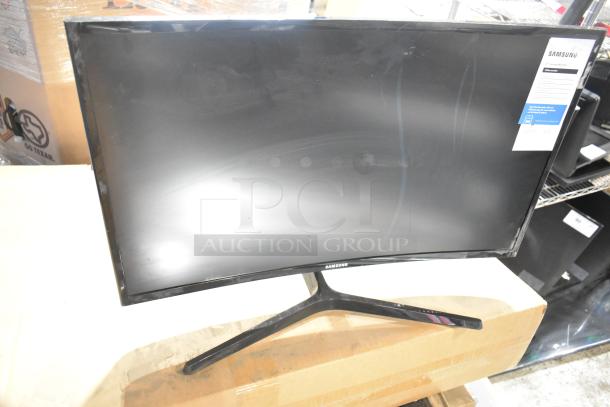 Samsung C27F396FHN curved monitor, 27 inches. Display shows minor wear. Samsung label and specs visible.