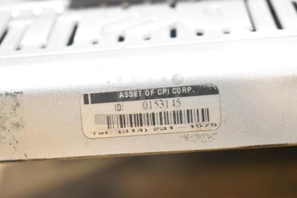 5 computer monitors, including Dell, asset tag labeled "Asset of CPI Corp," ID 0153145, used condition.