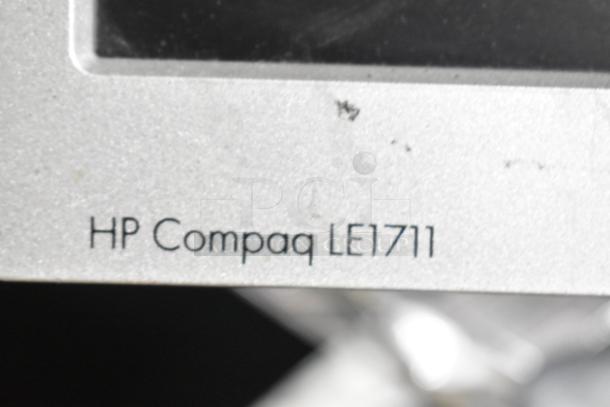 HP Compaq LE1711 monitor shown with visible label; part of a 3-piece computer monitor auction including Dell and HP models.