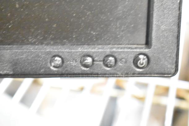 Close-up of control buttons on a computer monitor. Includes settings and power icons. Sold as part of a lot with Dell and HP monitors.