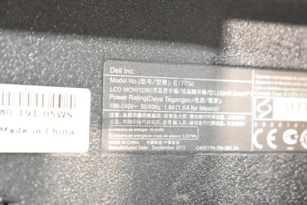 Close-up of a Dell monitor label, Model E170Sc, 17-inch LCD, power rating 100-240V, manufactured September 2011 in China.