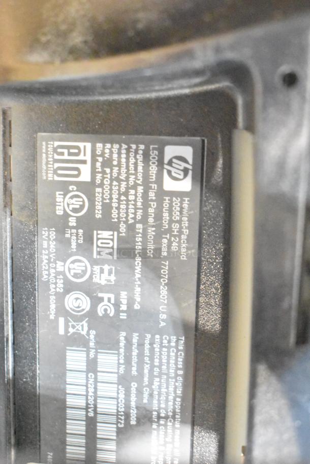 Label on HP L5006tm flat panel monitor, regulatory model R8164A, manufactured in 2008, with UL and FCC certification.