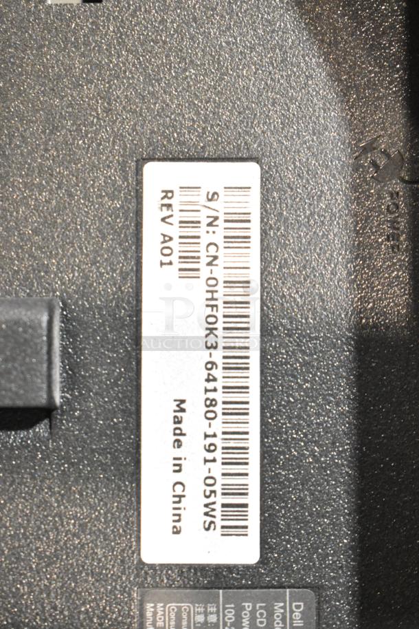 Label on computer monitor showing serial number CN-0HF0K3-64180-191-05WS, REV A01, Made in China.