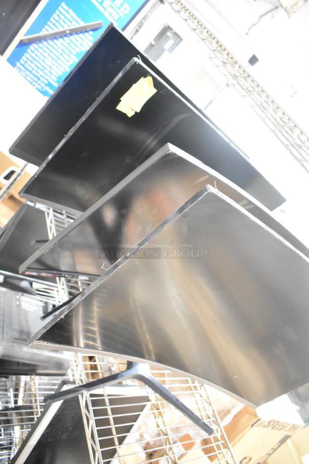 Four computer monitors including Samsung C32R500FHN and LG, in good condition, stacked vertically.