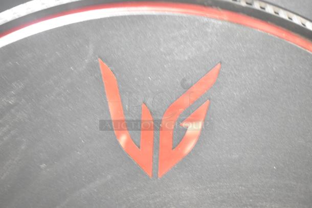 Close-up of a red "VG" logo on a dark background, likely part of one of the computer monitors available in the auction set.