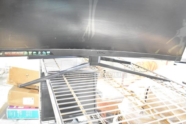 4 computer monitors including Samsung C32R500FHN and LG, auction item set on a metal shelf, good condition.