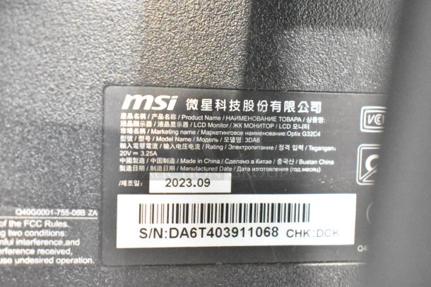 Label on MSI monitor with model Optix G32C4, made in China, manufactured 2023.09. Serial number: DA6T403911068.