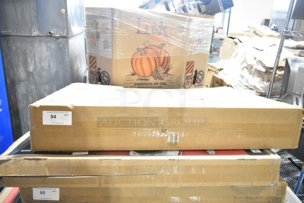 Boxed TCL 43" TV and Wren LED Monitor on pallet for auction. Labels indicate item quantity and auction website details.