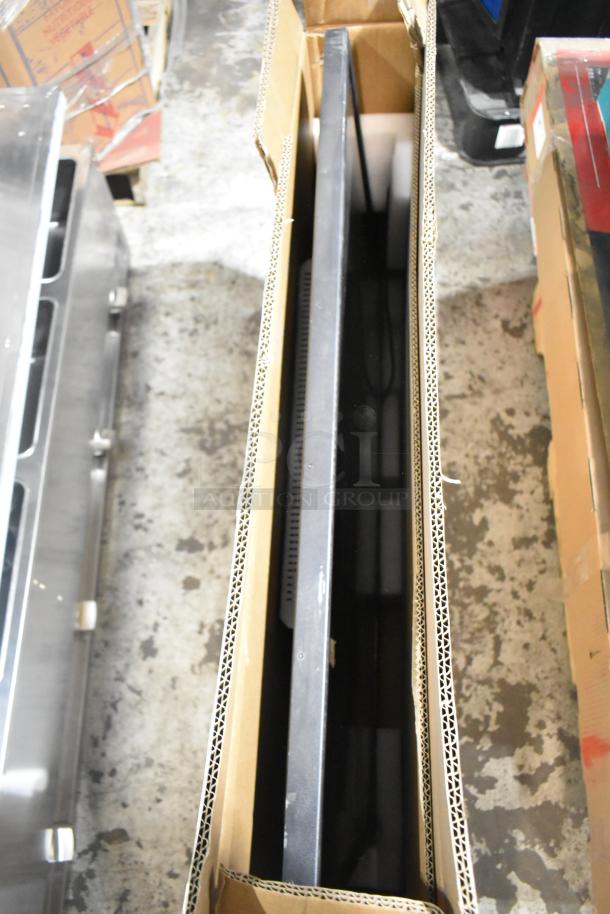 TCL 43" TV and Wren LED Monitor in original box, side view. New condition, packed with protective cardboard.