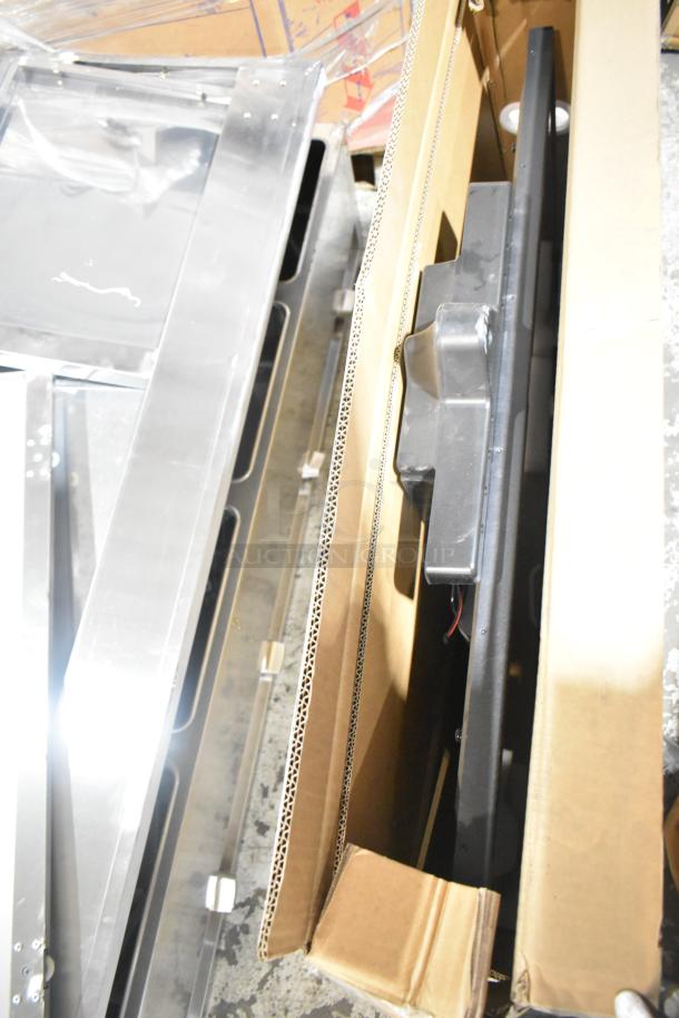 Hisense 50" UHD 4K TV and Wren LED Monitor in original boxes shown partially packed. Buyer pick-up required.