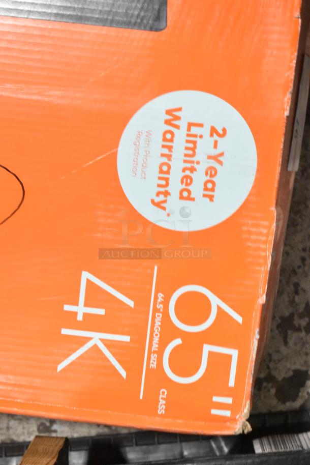 Onn Roku 65" 4K TV in original box, 2-year limited warranty shown. Buyer pickup required. Box slightly worn.