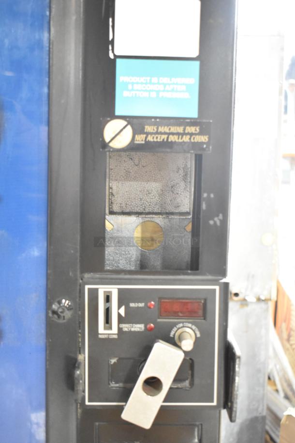 Royal RVCDE-768-10 metal vending machine, 115 volts, 1 phase. Coin slot visible, does not accept dollar coins.