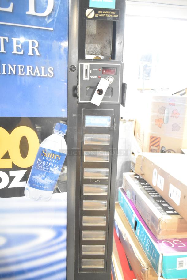 Royal RVCDE-768-10 metal commercial vending machine, 115 volts, 1 phase. Features coin slot, display, and product slots.