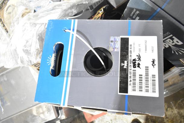 Box of Paige CAT 5E cable, 1000 ft, gray box with product label and visible cable spool.