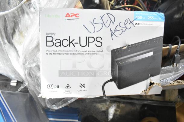 Box of APC by Schneider Electric Battery Back-UPS, 450VA/255W, six outlets. Box labeled "USED ASSET". Torn packaging.