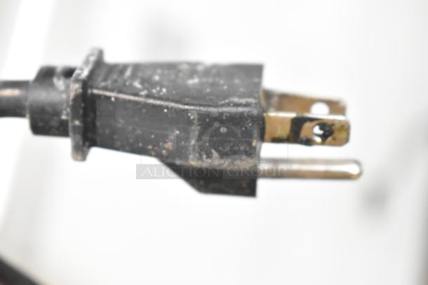 Close-up of a two-prong electrical plug for a Vestfrost SCF1212DT Chest Freezer Merchandiser, 115 volts, 1 phase.