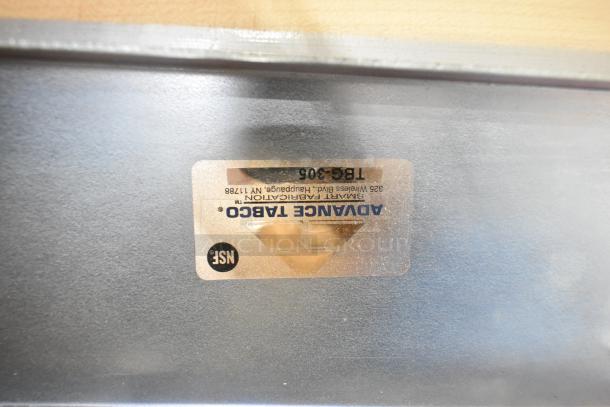Label on metal surface reads "Advance Tabco, Smart Fabrication, Model TBG-305, Hauppauge, NY 11788, NSF certified."