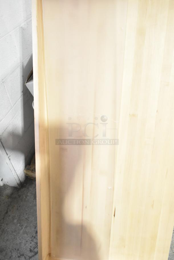 Clear poly panel and wooden butcher block tabletop in good condition. Two items included. Auction bidding applies.