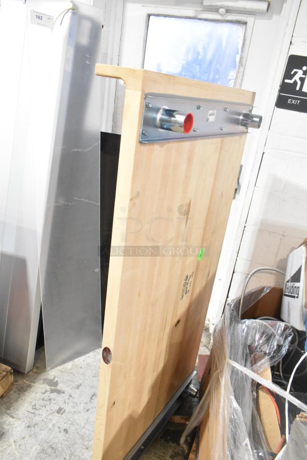 Wooden butcher block tabletop with metal mounting brackets, alongside clear poly panel. Auction lot with two items.