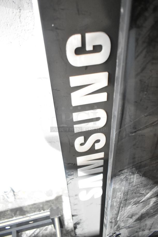 Samsung Luxfit LED Light Panel, features sleek design, visible Samsung logo, in good condition, ideal for modern lighting.