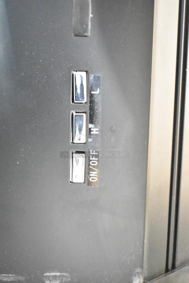 Boltic 6873518LYB black metal air curtain with 120V, 1 phase. Features control switches for on/off and high/low settings.