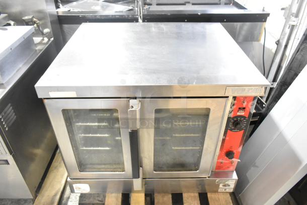 Vulcan VC6GE-SEFFCAM5 stainless steel commercial gas convection oven, view-through doors, metal racks, thermostatic controls.