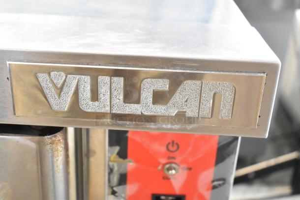 Vulcan VC6GE-SEFFCAM5 stainless steel commercial convection oven with view-through doors, metal racks, and thermostatic controls.