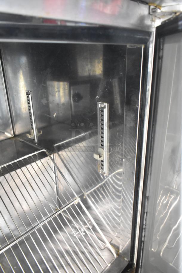 Turbo Air stainless steel undercounter cooler interior, featuring adjustable shelves, 3 doors, 115V, 1 phase.
