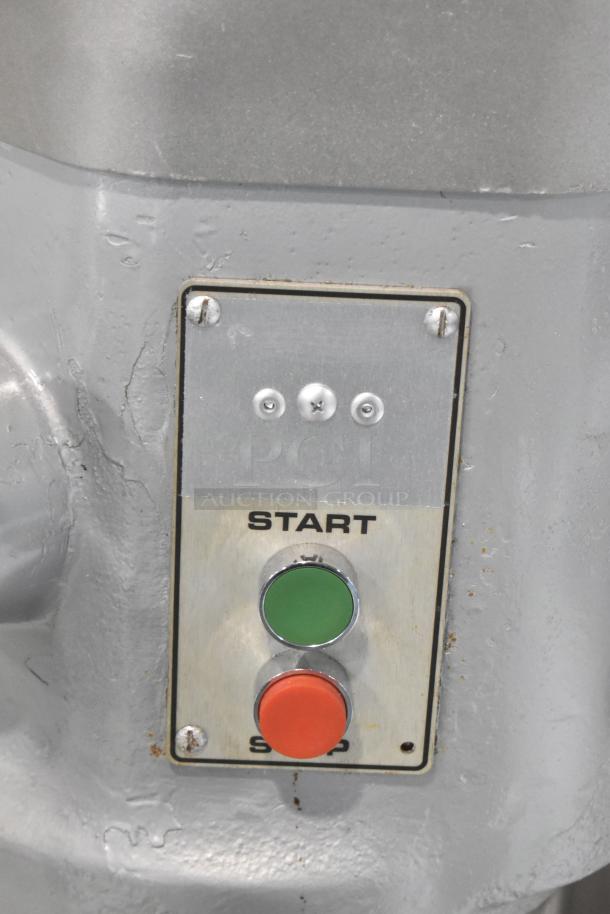 Hobart H-600 commercial dough mixer control panel with start and stop buttons, indicating operation controls.