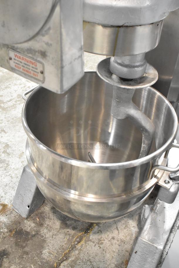 Hobart H-600 Commercial 60 Qt Dough Mixer with pelican head, mixing bowl, and dough hook attachment. Visible warning label.