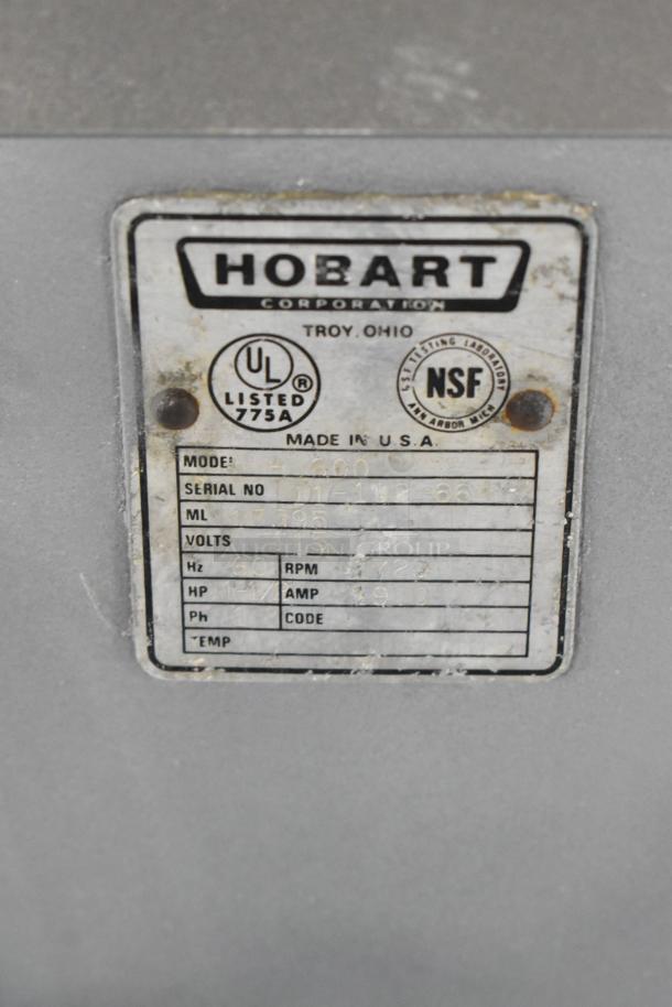 Hobart H-600 commercial mixer, 60-quart, with Pelican head, mixing bowl, dough hook. 115/240V, 3 phase. Model label visible.
