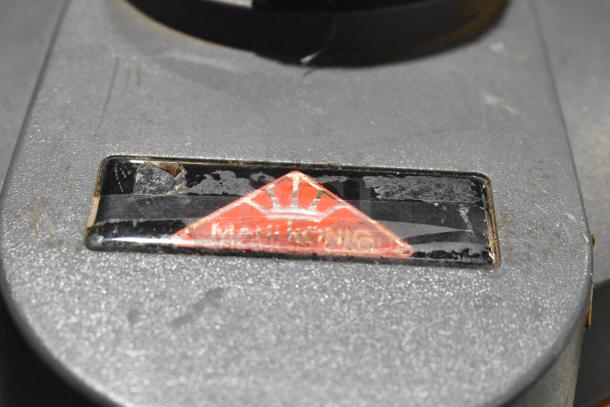 Mahlkonig Tanzania Grau metal espresso bean grinder without hopper, 120V, 1-phase. Visible worn Mahlkonig logo.