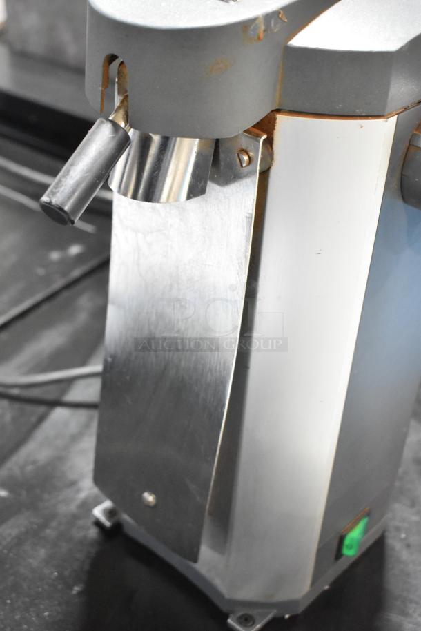 Mahlkonig Tanzania Grau metal espresso grinder, countertop model without hopper, showing wear. 120V, 1 Phase, power switch visible.