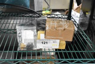 Four brand new scratch and dent items, including Bunn 50408.0000 valve, Galaxy 177PGSM353 controller, Narvon 378PAF4796 power supply, and Narvon 378PAF3981 flow meter. Box with labels on metal shelf.