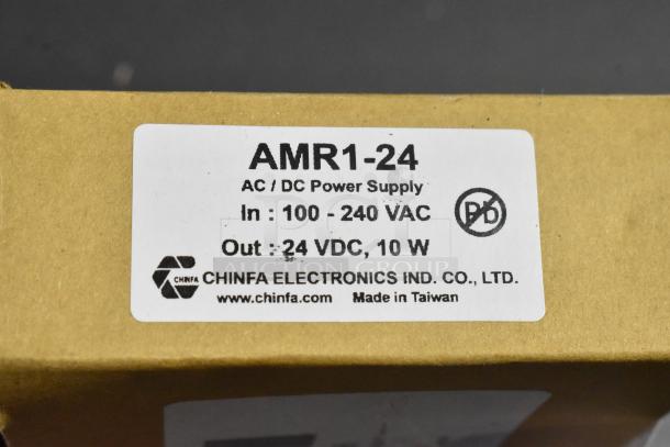 Cardboard box with AMR1-24 power supply label from Chinfa Electronics, 24VDC, 10W, made in Taiwan.