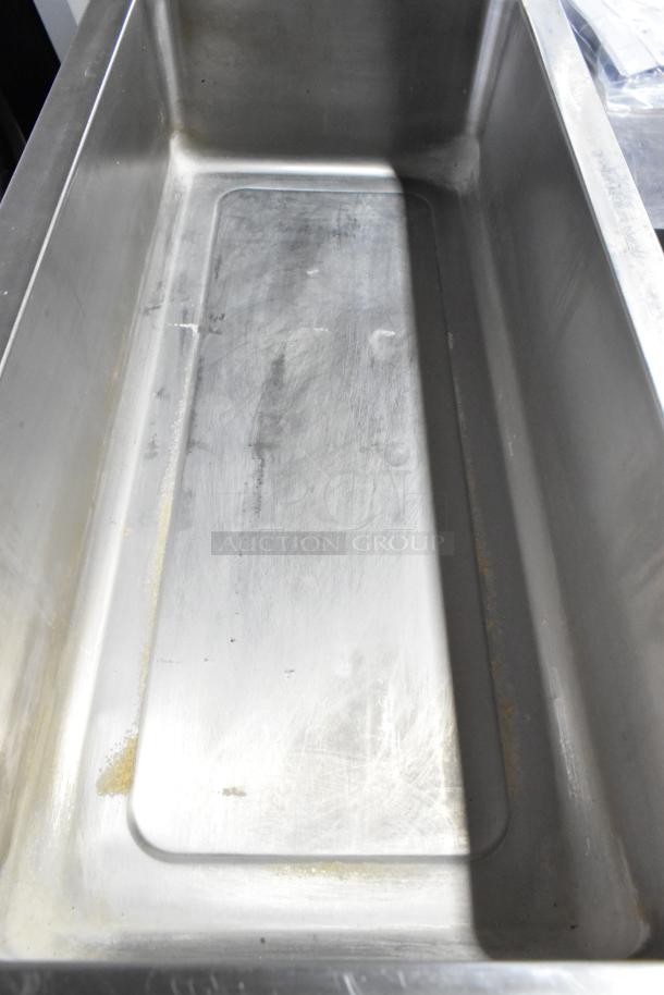 Winco FW-L600 stainless steel commercial countertop food warmer, used condition. Model FW-L600, 120 volts, 1 phase.