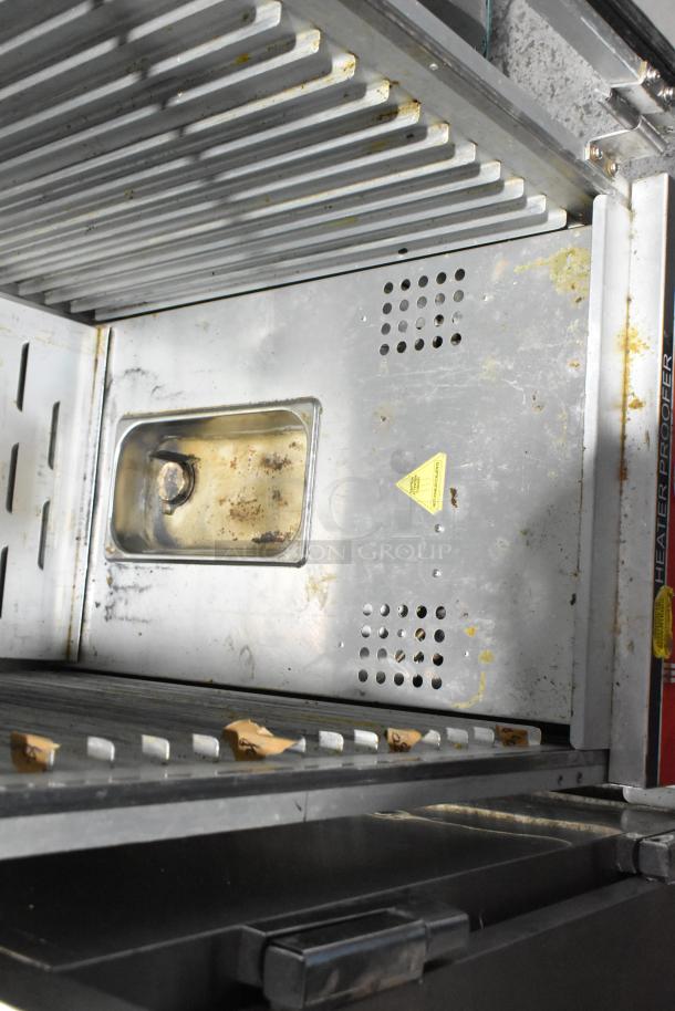 2018 Bevles HPIC-6836 metal heated holding cabinet, commercial casters, visible wear and residue, 120V, 1 phase, model label.