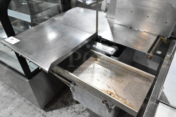 Butcher Boy B12-F Metal Commercial Floor Meat Saw, 115V, 1 Phase. Large cutting surface, used condition. Model tag visible.
